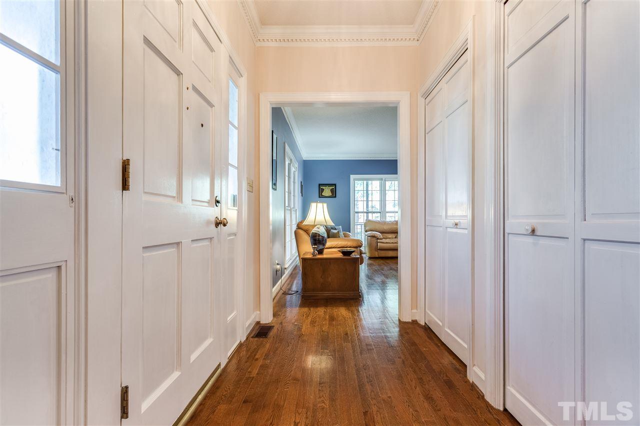 8108 Mourning Dove Road Raleigh, NC 27615 - Photo 9 of 25 a view of a living room with furniture and wooden floor