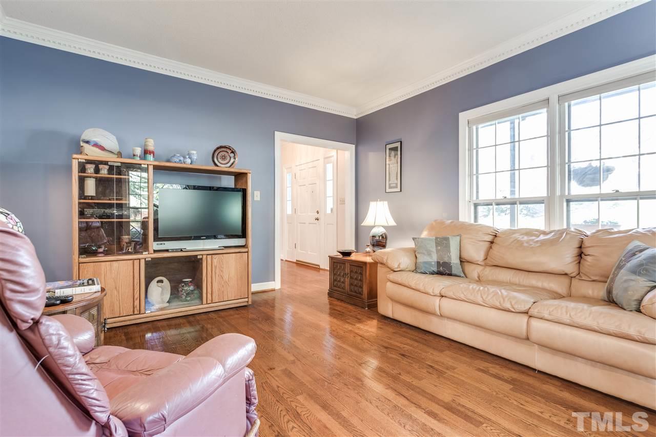 8108 Mourning Dove Road Raleigh, NC 27615 - Photo 10 of 25 a living room with furniture and a flat screen tv