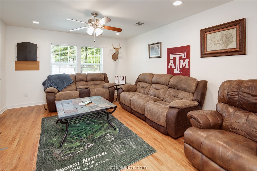 1204 East 28th Street Bryan, TX 77803 - Photo 5 of 22 a living room with furniture a rug and a window