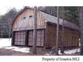 58 John Sheehan Road Mehoopany, PA 18629 - Photo 4 of 5 a view of a small house with a wooden fence