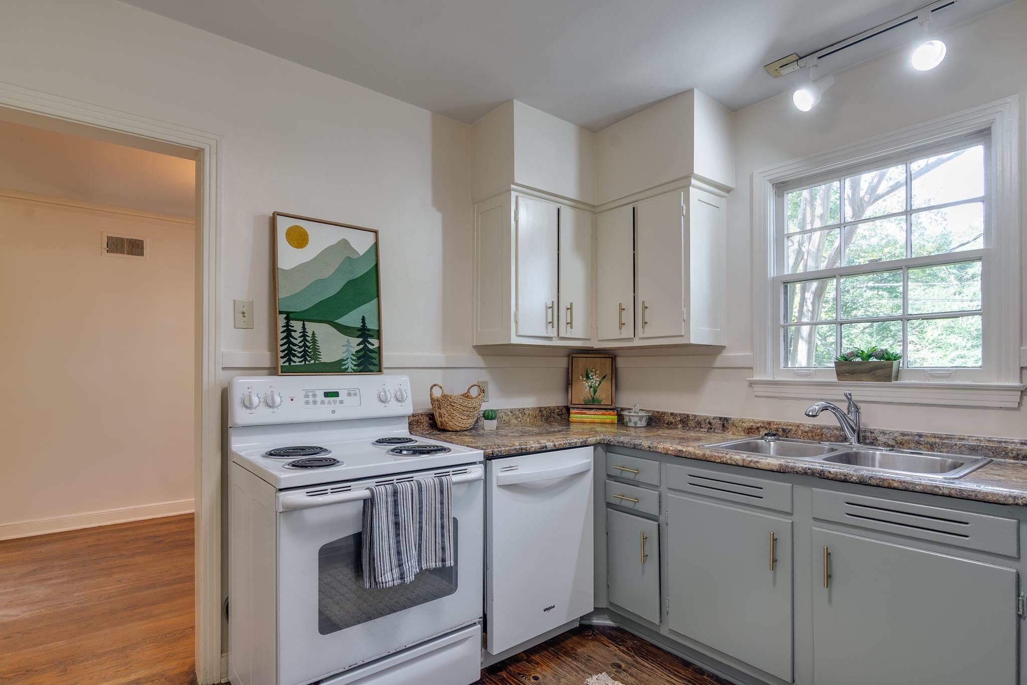 695 Berry Road Memphis, TN 38117 - Photo 11 of 32 a kitchen with stainless steel appliances granite countertop a sink stove and cabinets