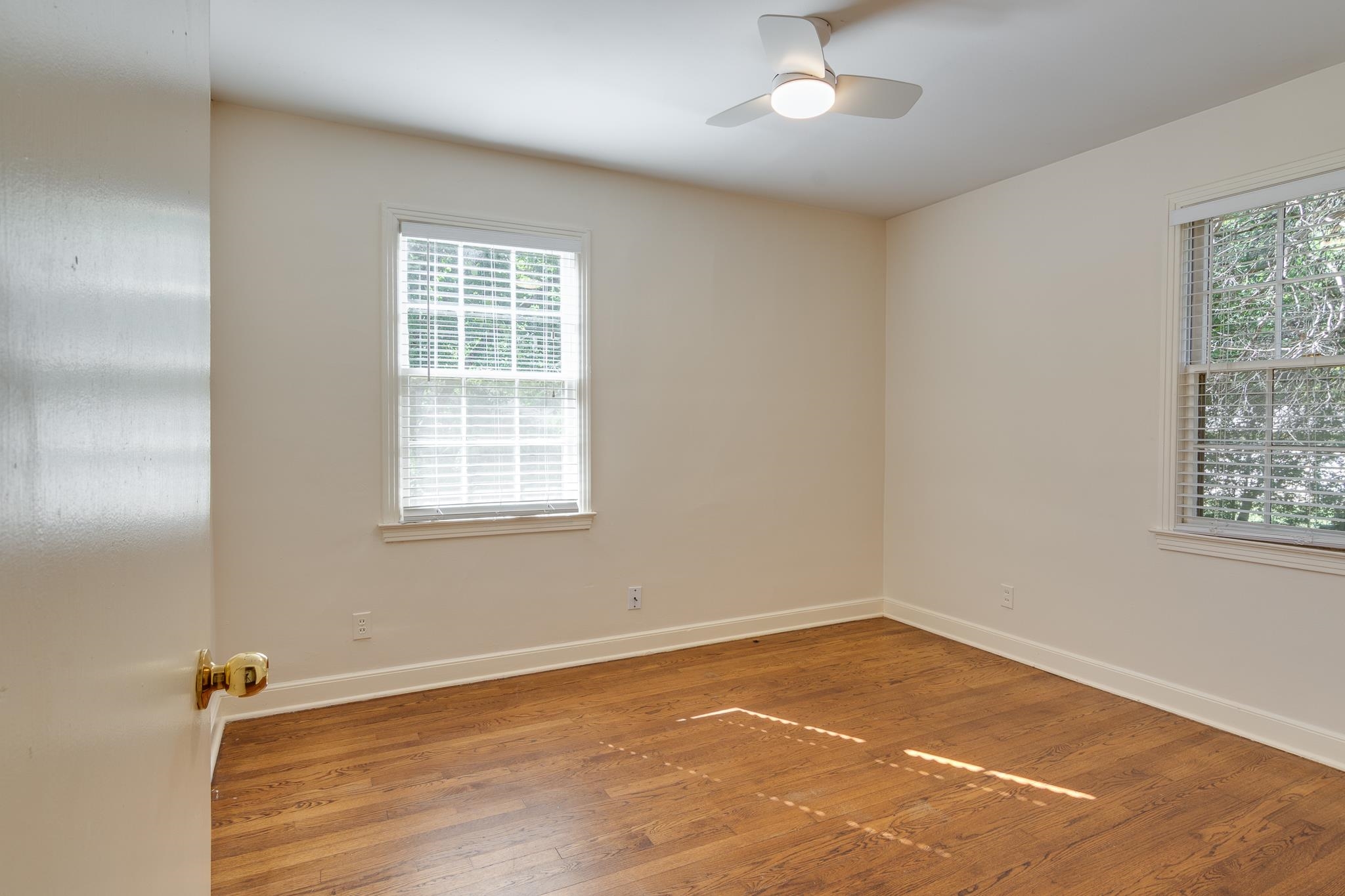 695 Berry Road Memphis, TN 38117 - Photo 17 of 32 wooden floor in an empty room with a window