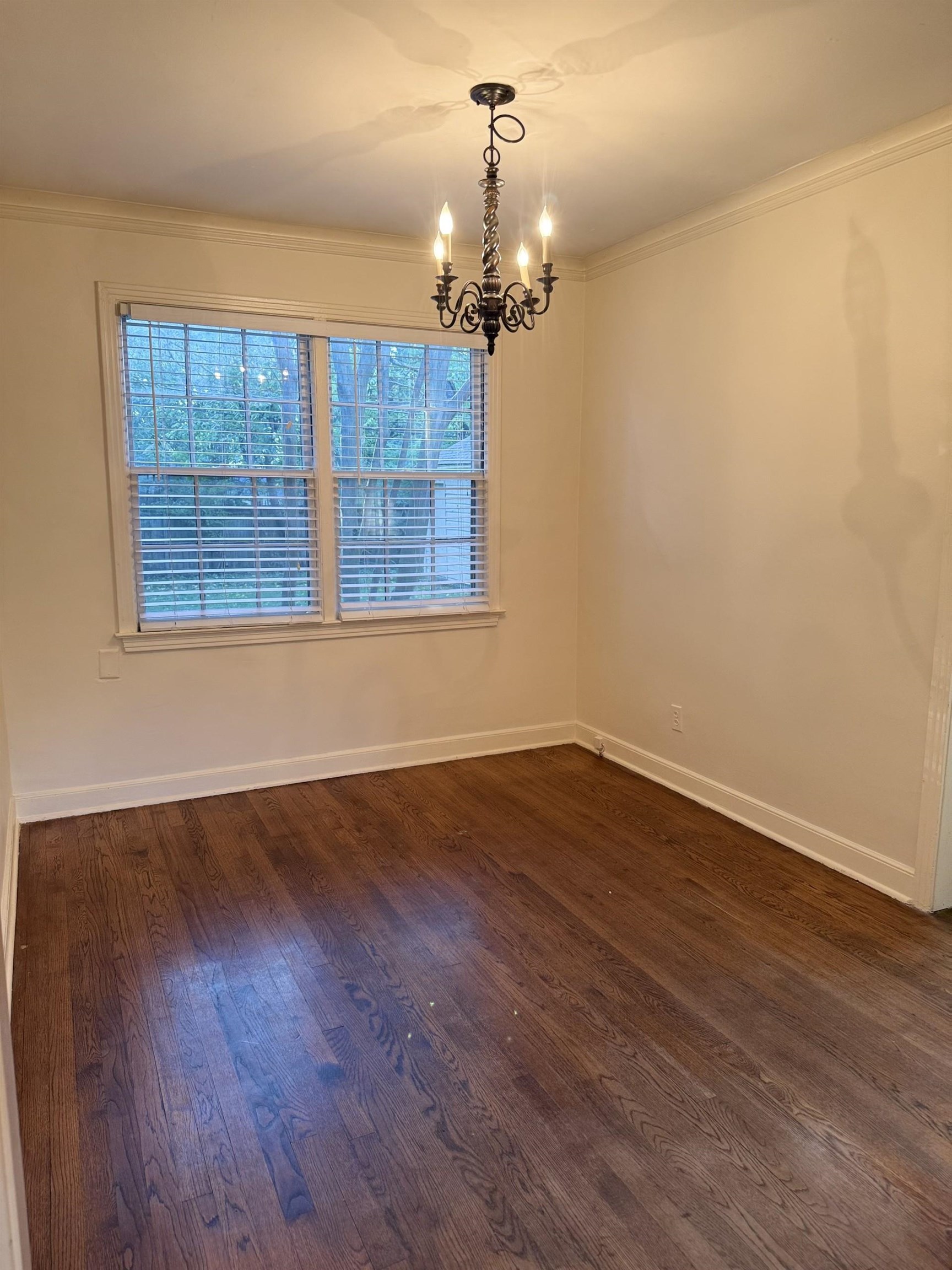 695 Berry Road Memphis, TN 38117 - Photo 28 of 32 a view of an empty room with wooden floor and a window