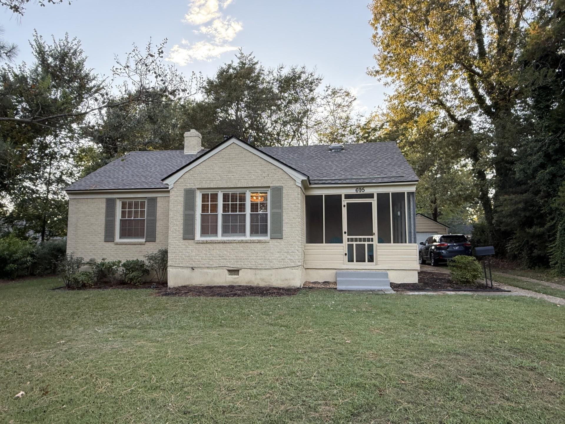 695 Berry Road Memphis, TN 38117 - Photo 29 of 32 a front view of a house with a garden