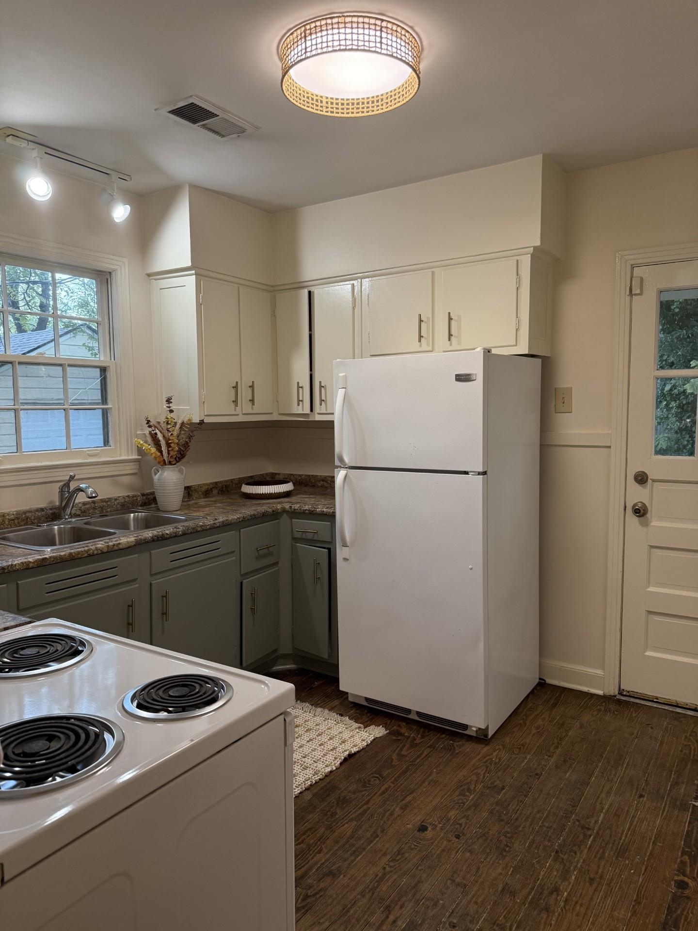 695 Berry Road Memphis, TN 38117 - Photo 32 of 32 a kitchen with sink refrigerator and stove