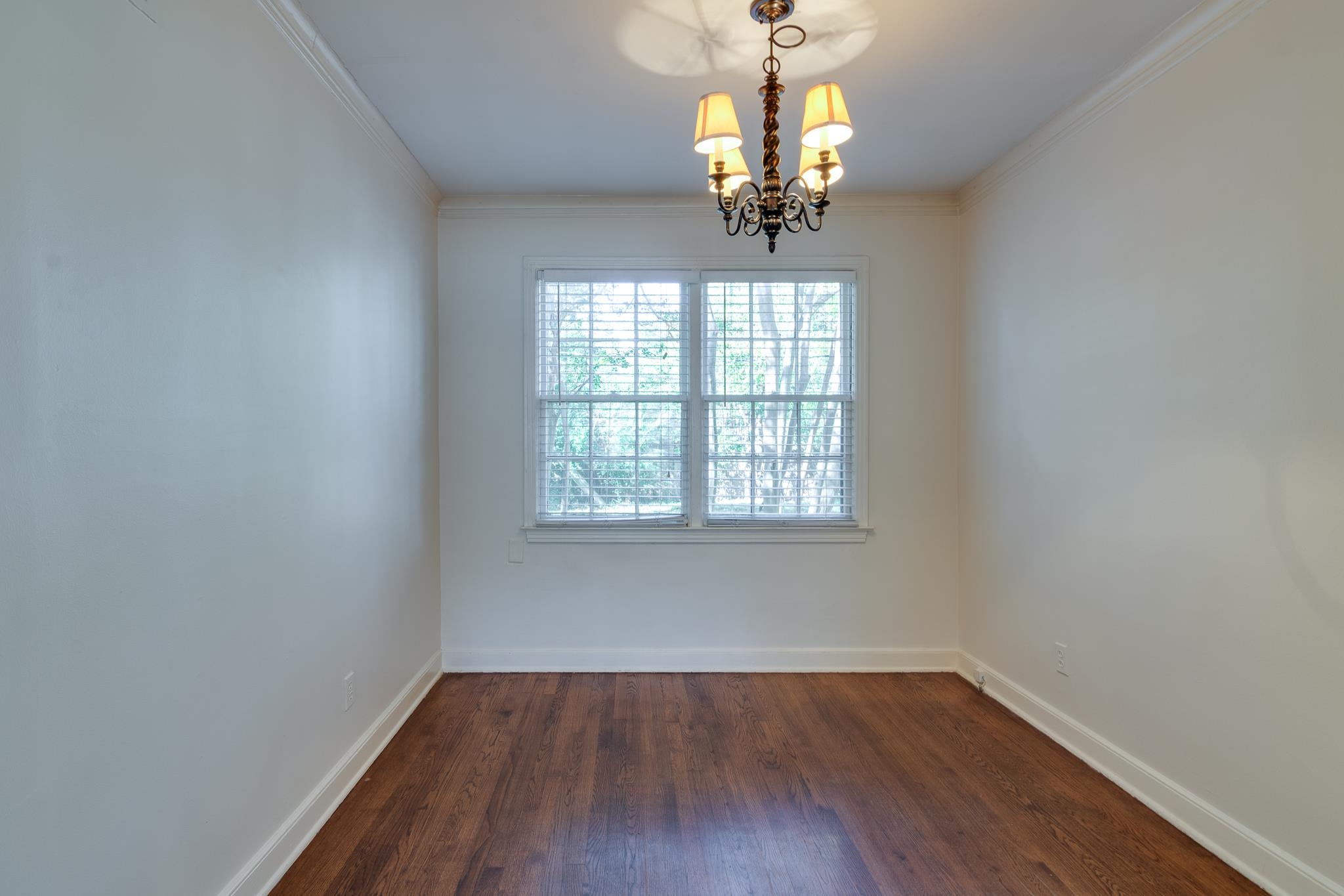 695 Berry Road Memphis, TN 38117 - Photo 6 of 32 wooden floor in an empty room with a window