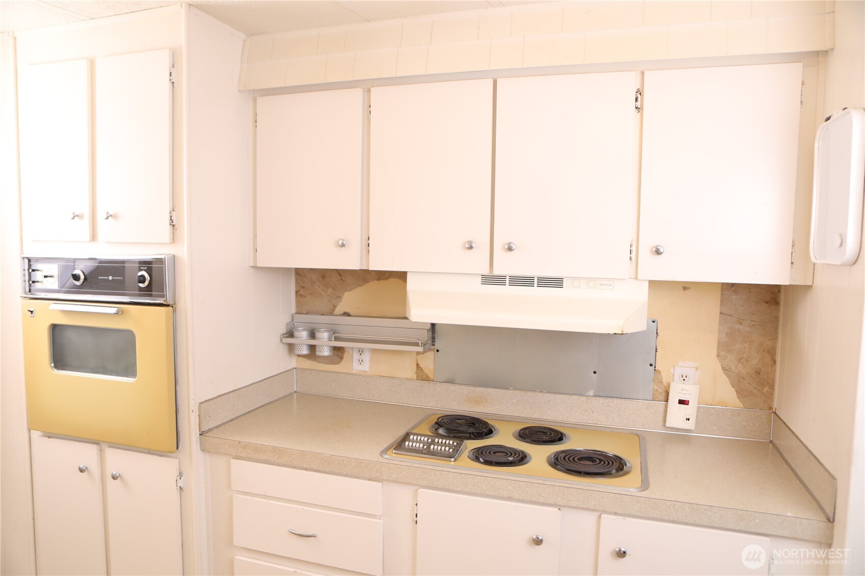 410 Totem Pole Road Manson, WA 98831 - Photo 12 of 27 a kitchen with a sink a stove and cabinets