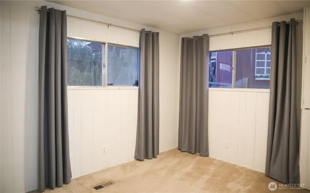 a view of a hallway with a large window