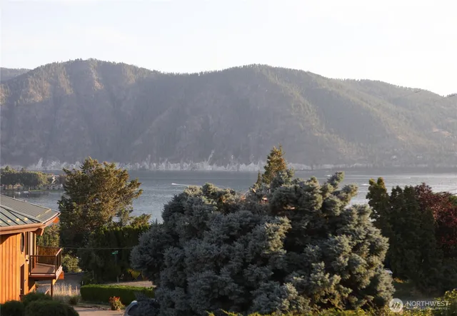 a view of a town with mountains in the background