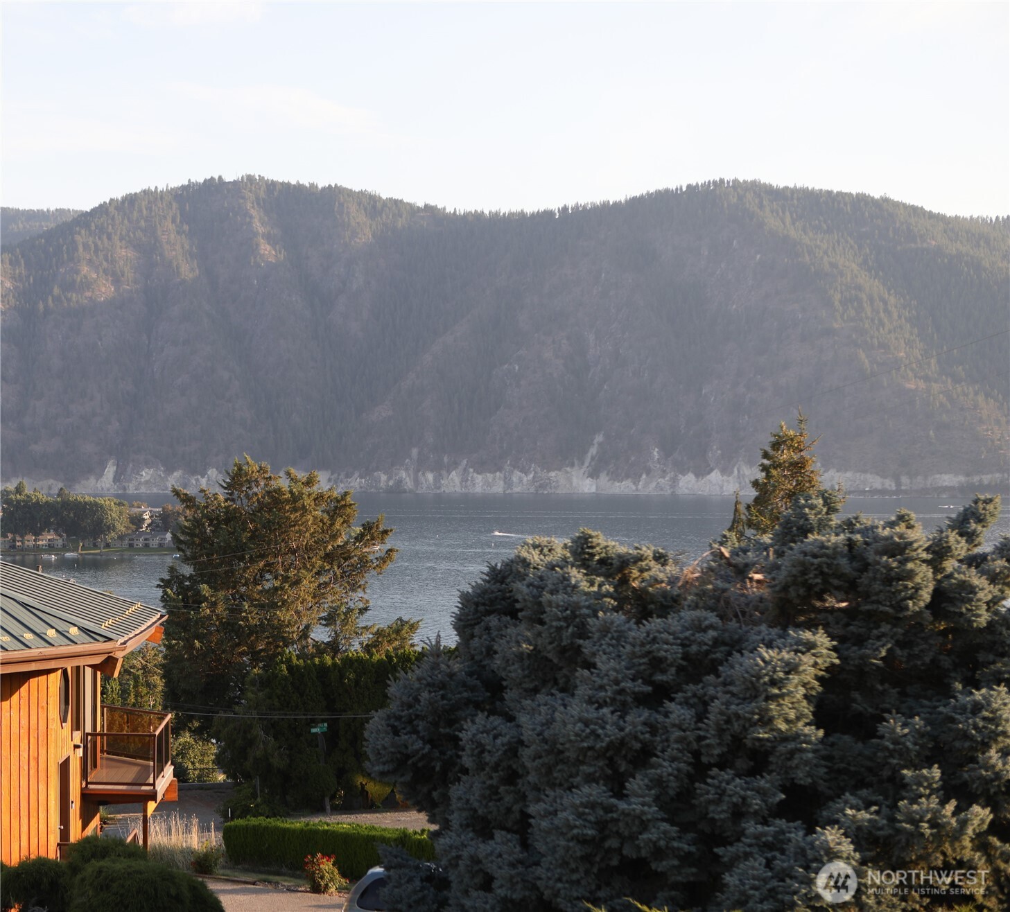410 Totem Pole Road Manson, WA 98831 - Photo 27 of 27 a view of a town with mountains in the background