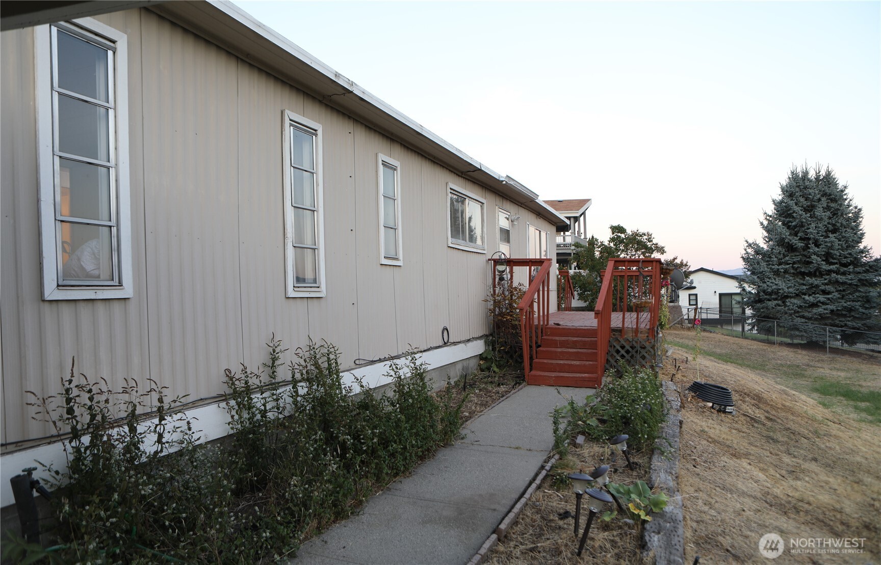 410 Totem Pole Road Manson, WA 98831 - Photo 4 of 27 a front view of a house with garden