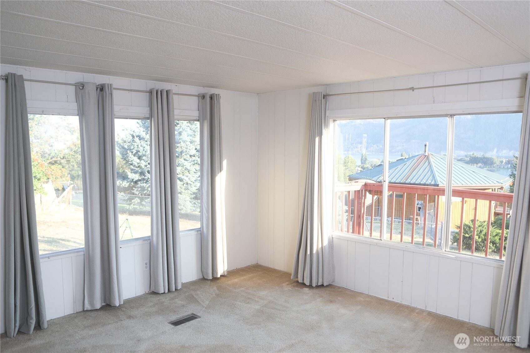 410 Totem Pole Road Manson, WA 98831 - Photo 8 of 27 a view of an empty room with a window