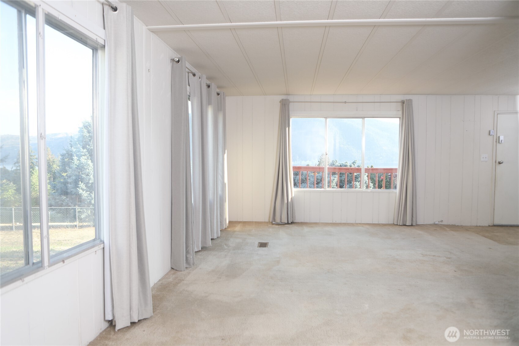 410 Totem Pole Road Manson, WA 98831 - Photo 9 of 27 a view of an empty room and window
