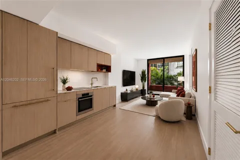 a kitchen with sink refrigerator and stove