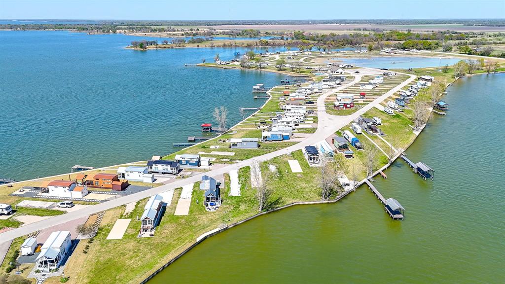 Lot 118 Peninsula Road Kerens, TX 75144 - Photo 14 of 37 an aerial view of a house with a ocean view