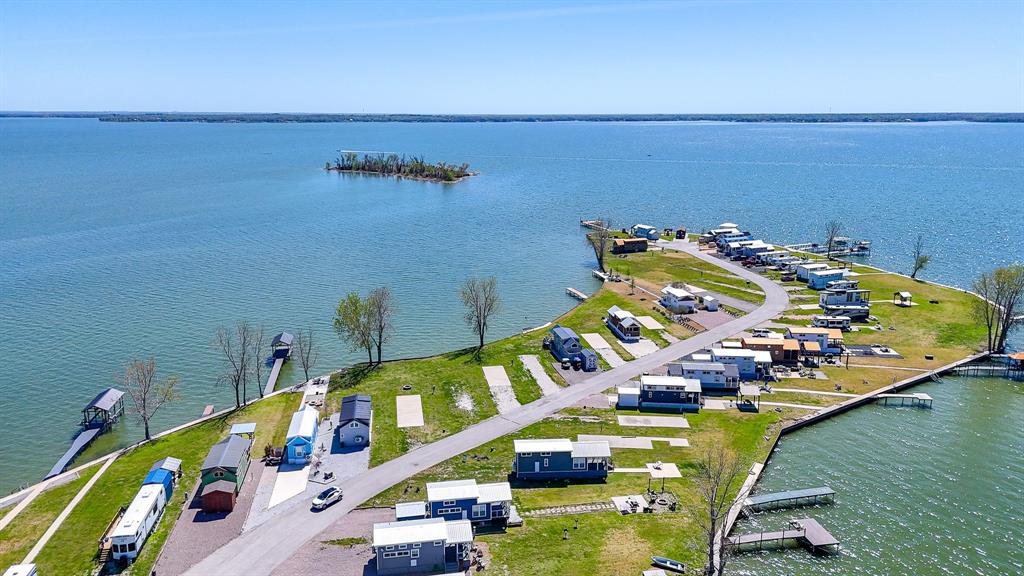 Lot 118 Peninsula Road Kerens, TX 75144 - Photo 16 of 37 an aerial view of a an ocean swimming pool and outdoor seating