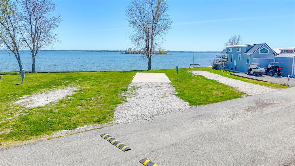Lot 118 Peninsula Road Kerens, TX 75144 - Photo 2 of 37 a view of a swimming pool with a patio