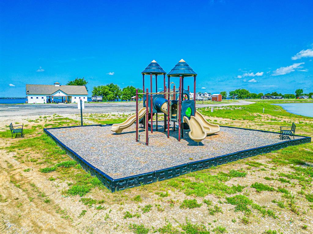 Lot 118 Peninsula Road Kerens, TX 75144 - Photo 34 of 37 a view of a swimming pool with a patio and a yard