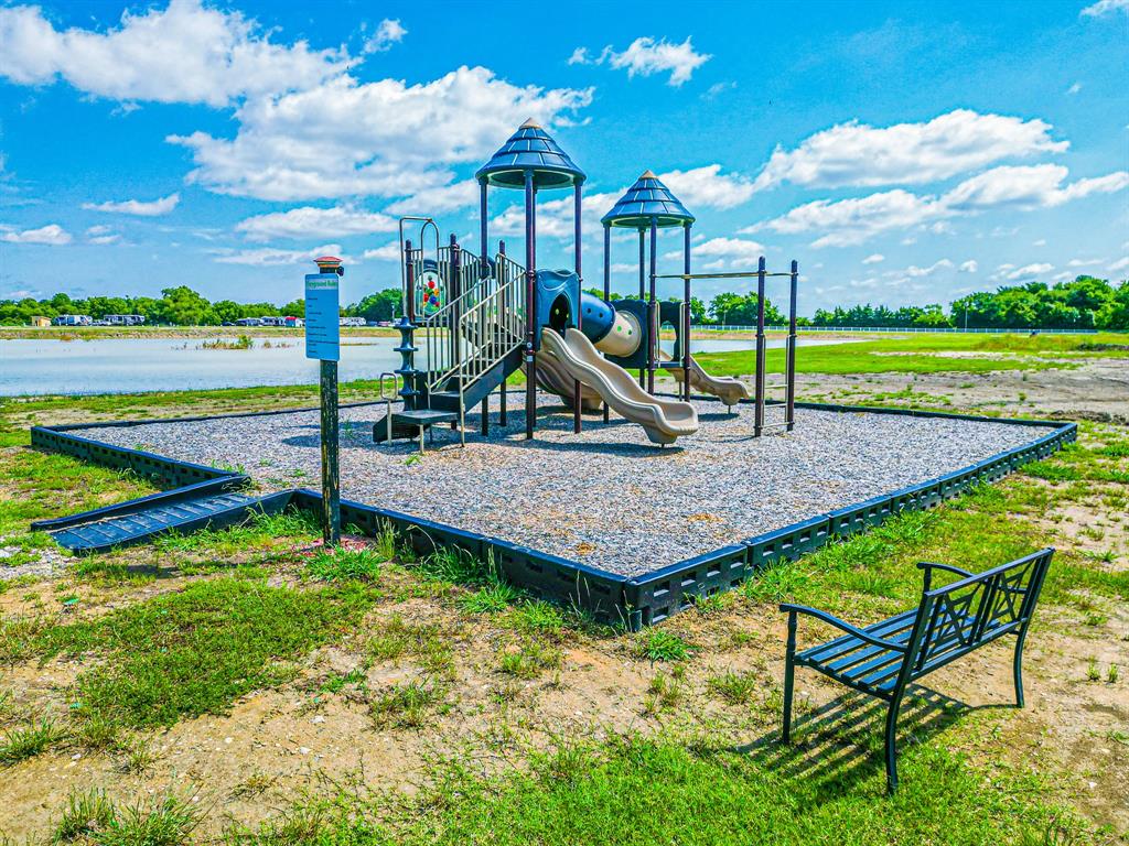 Lot 118 Peninsula Road Kerens, TX 75144 - Photo 35 of 37 a view of a house with a yard potted plants and wooden fence