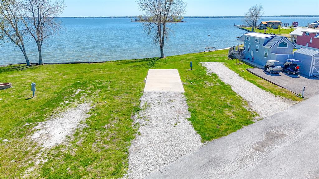 Lot 118 Peninsula Road Kerens, TX 75144 - Photo 4 of 37 a view of a backyard with plants