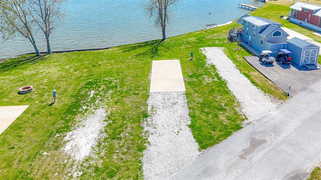 Lot 118 Peninsula Road Kerens, TX 75144 - Photo 6 of 37 a aerial view of a house with a garden