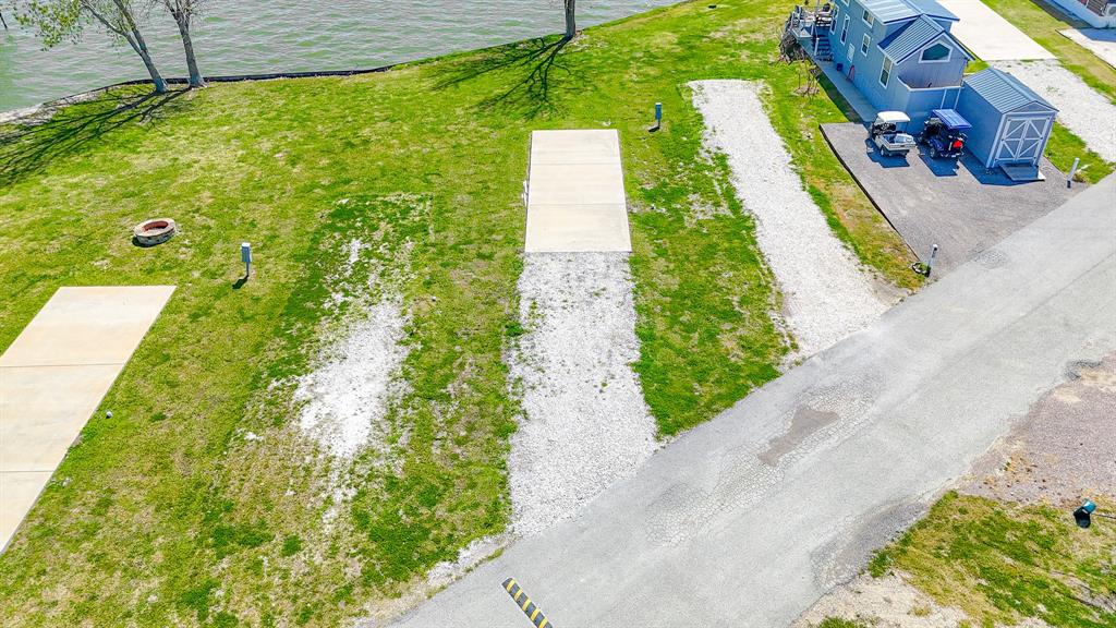 Lot 118 Peninsula Road Kerens, TX 75144 - Photo 7 of 37 a view of a yard with flower plants