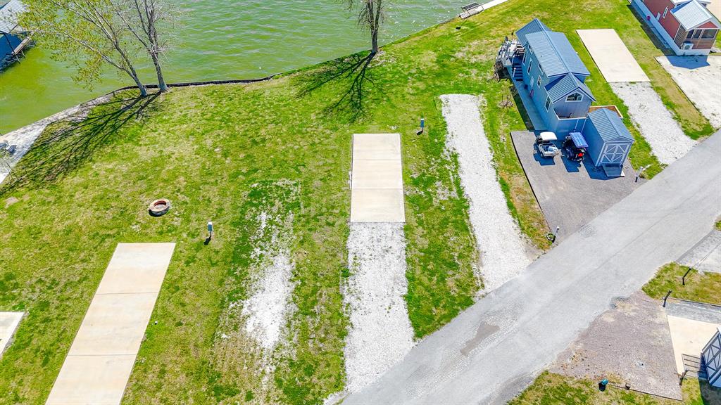 Lot 118 Peninsula Road Kerens, TX 75144 - Photo 8 of 37 a view of a yard with plants