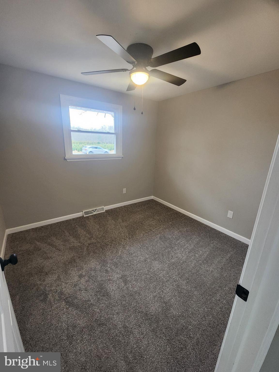 496 Big Oak Road Bridgeton, NJ 08302 - Photo 12 of 31 an empty room with a empty space and windows