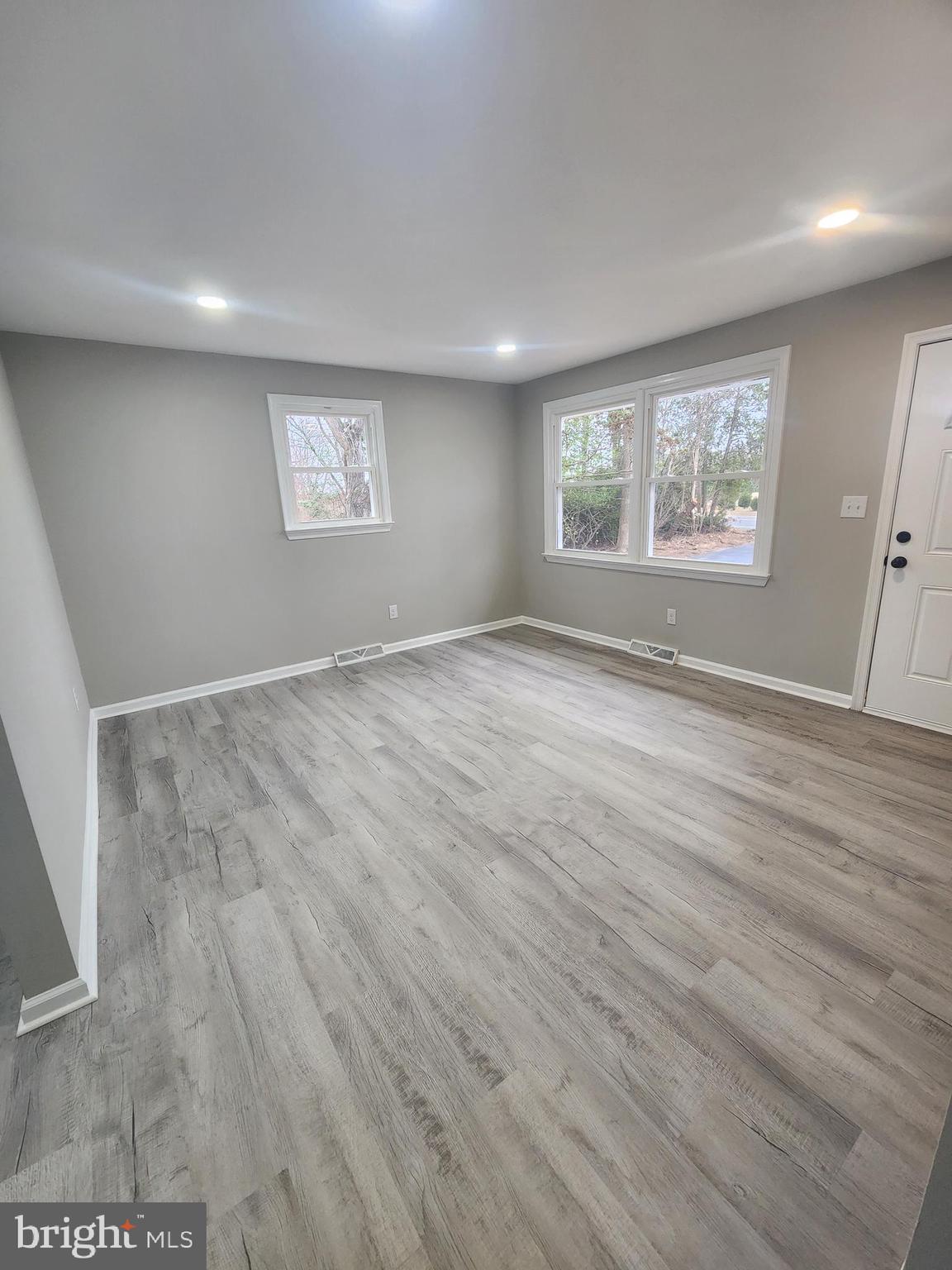 496 Big Oak Road Bridgeton, NJ 08302 - Photo 18 of 31 an empty room with wooden floor and windows