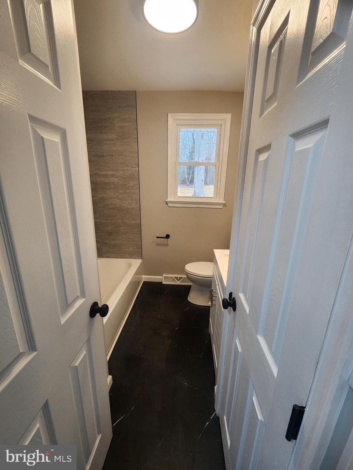 496 Big Oak Road Bridgeton, NJ 08302 - Photo 22 of 31 a bathroom with a sink a toilet a shower and a mirror