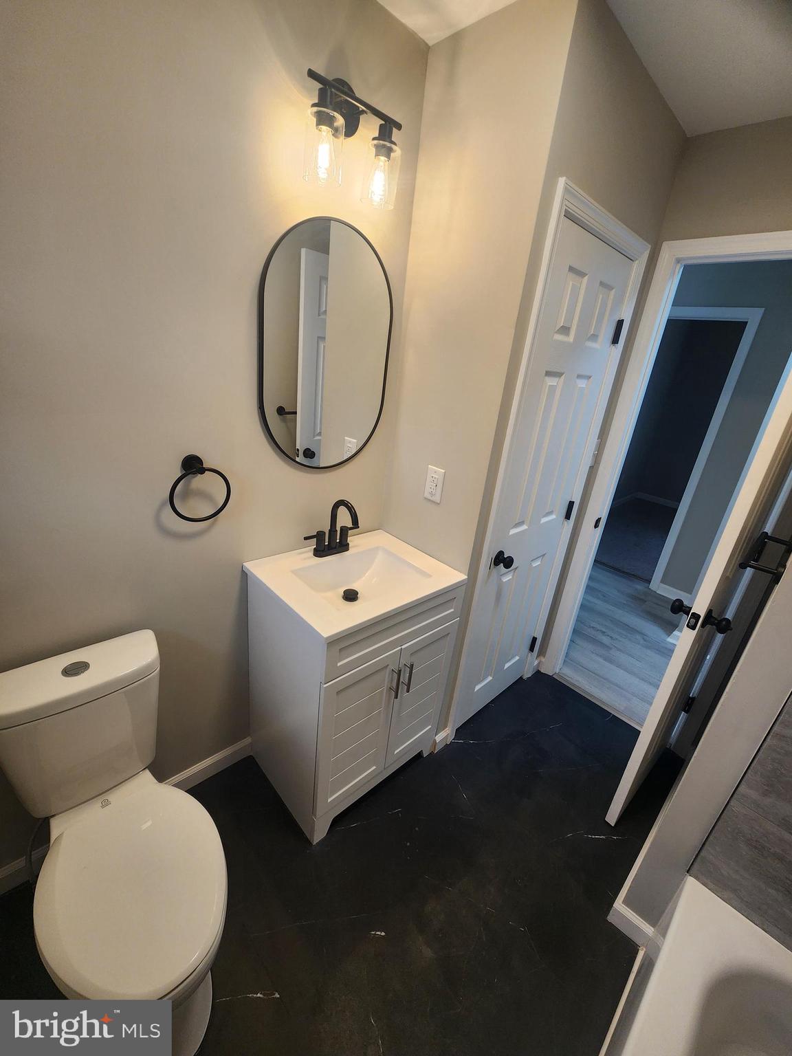 496 Big Oak Road Bridgeton, NJ 08302 - Photo 23 of 31 a bathroom with a toilet sink and mirror
