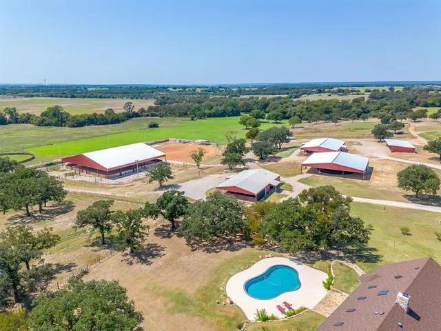 an aerial view of a house with a garden