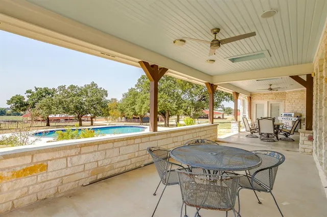 a outdoor dining space with furniture and outdoor view