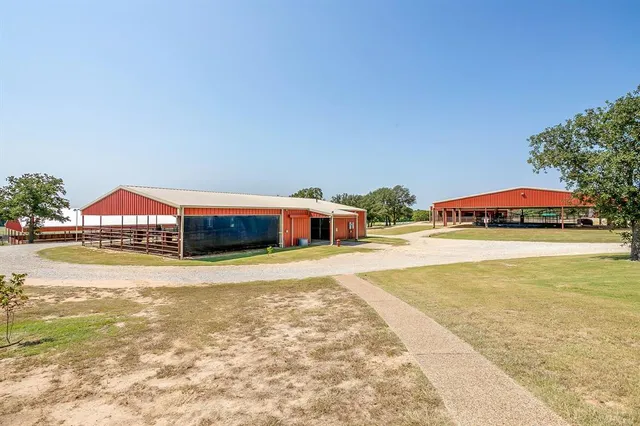 a swimming pool with outdoor seating and yard