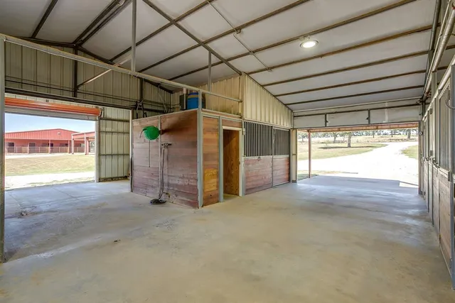 a view of empty room with wooden walls