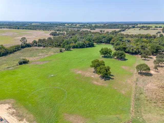 a view of a lake with a yard