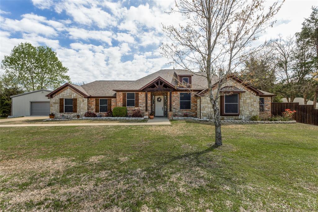 2245 Cross Post Lane Lowry Crossing, TX 75069 - Photo 1 of 1 a front view of a house with a garden