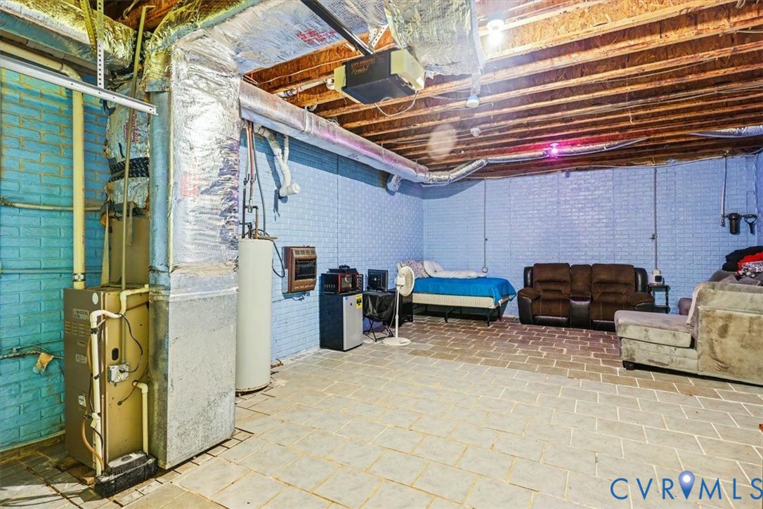62 The Fls Road Victoria, VA 23974 - Photo 23 of 36 Lower level utility area featuring a furnace, wate