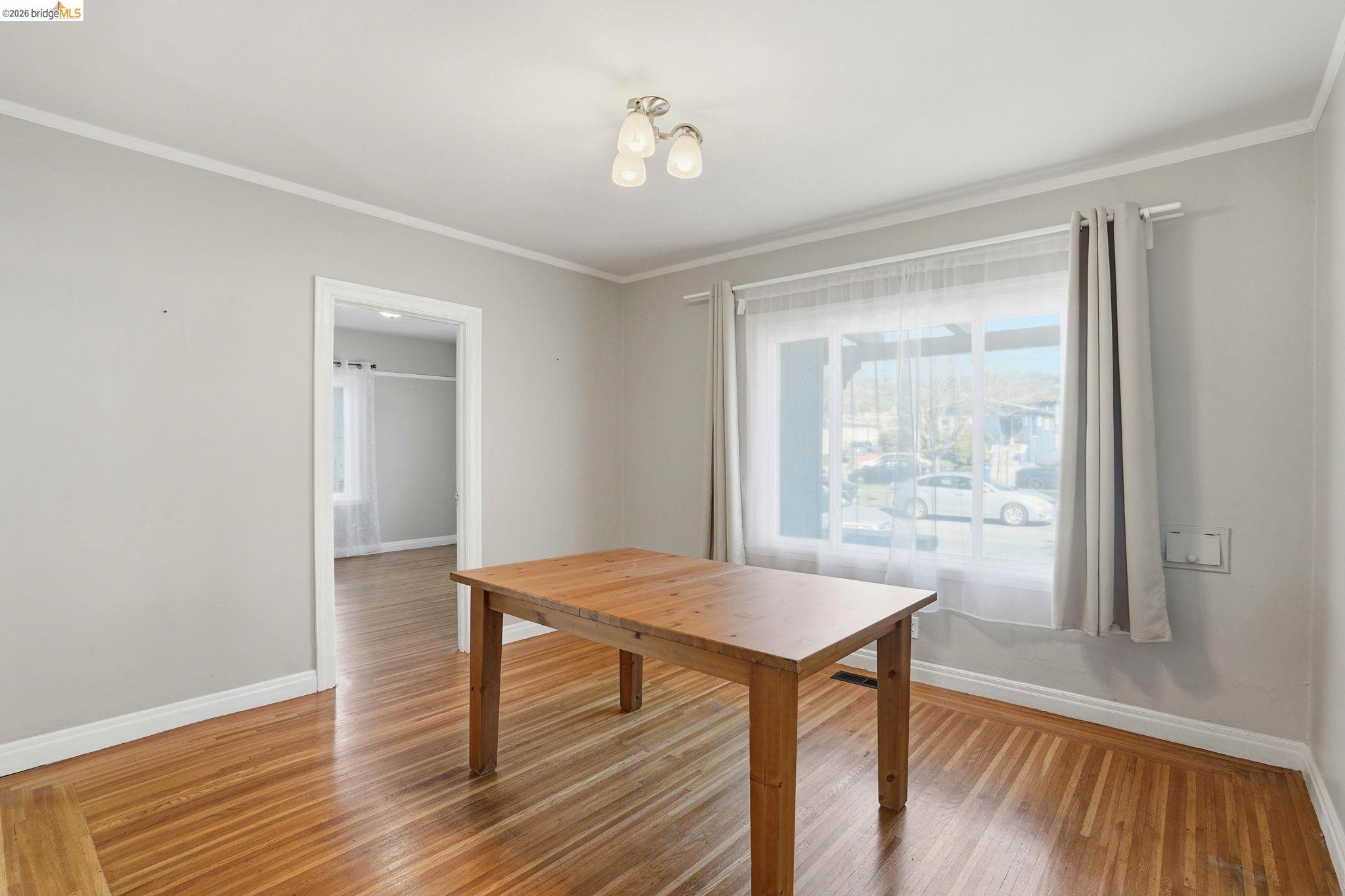 840 Key Rte Boulevard Albany, CA 94706 - Photo 16 of 43 Dining area featuring crown molding and light wood-type flooring