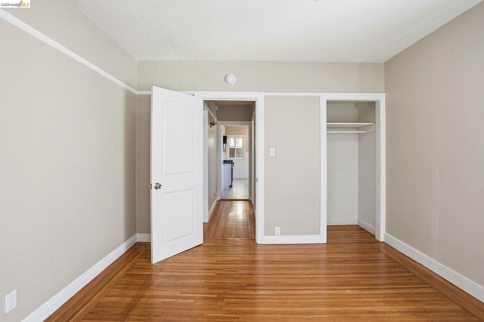 840 Key Rte Boulevard Albany, CA 94706 - Photo 23 of 43 Unfurnished bedroom featuring wood finished floors and a closet