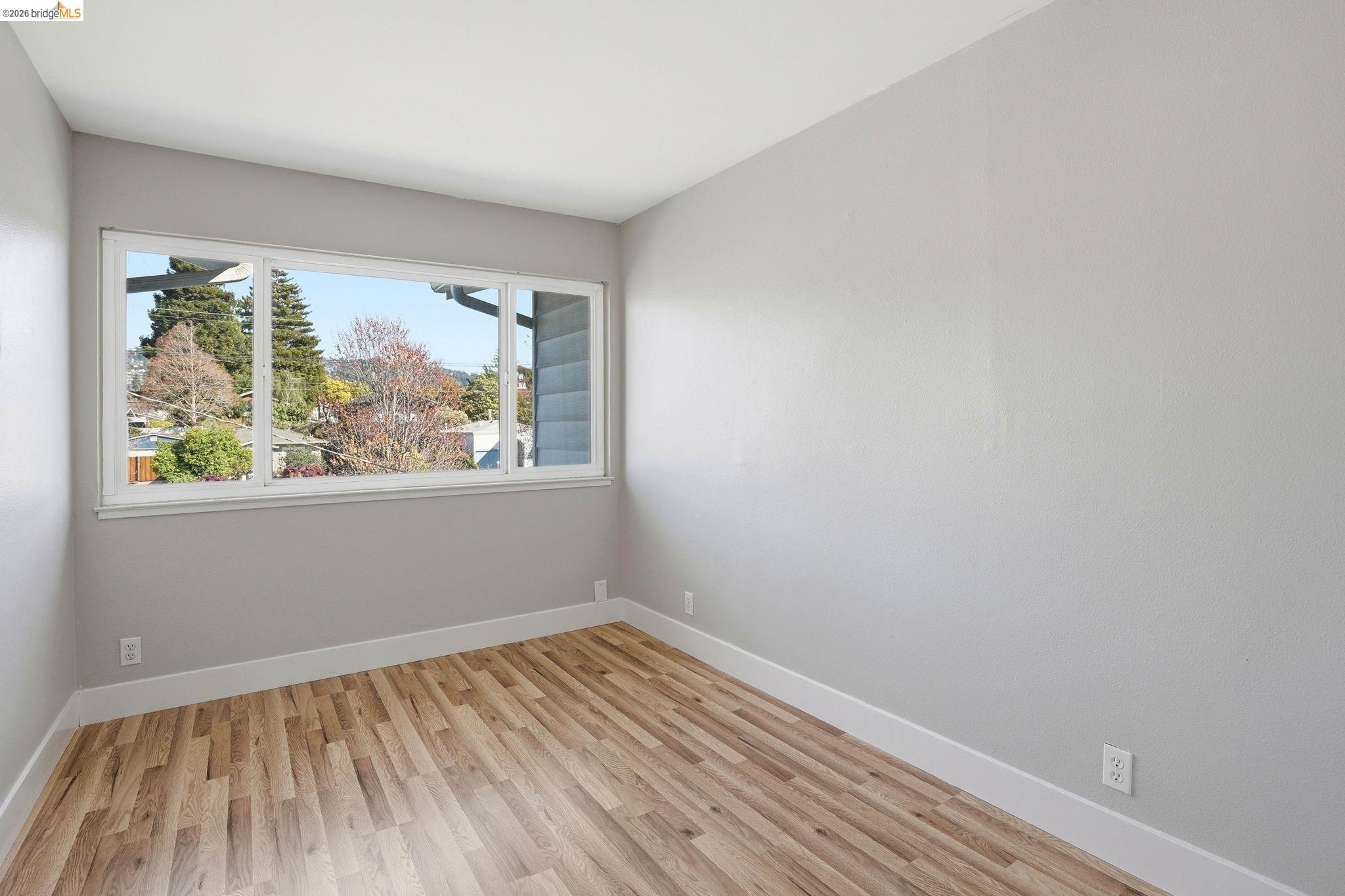 840 Key Rte Boulevard Albany, CA 94706 - Photo 25 of 43 Unfurnished room with light wood finished floors and baseboards