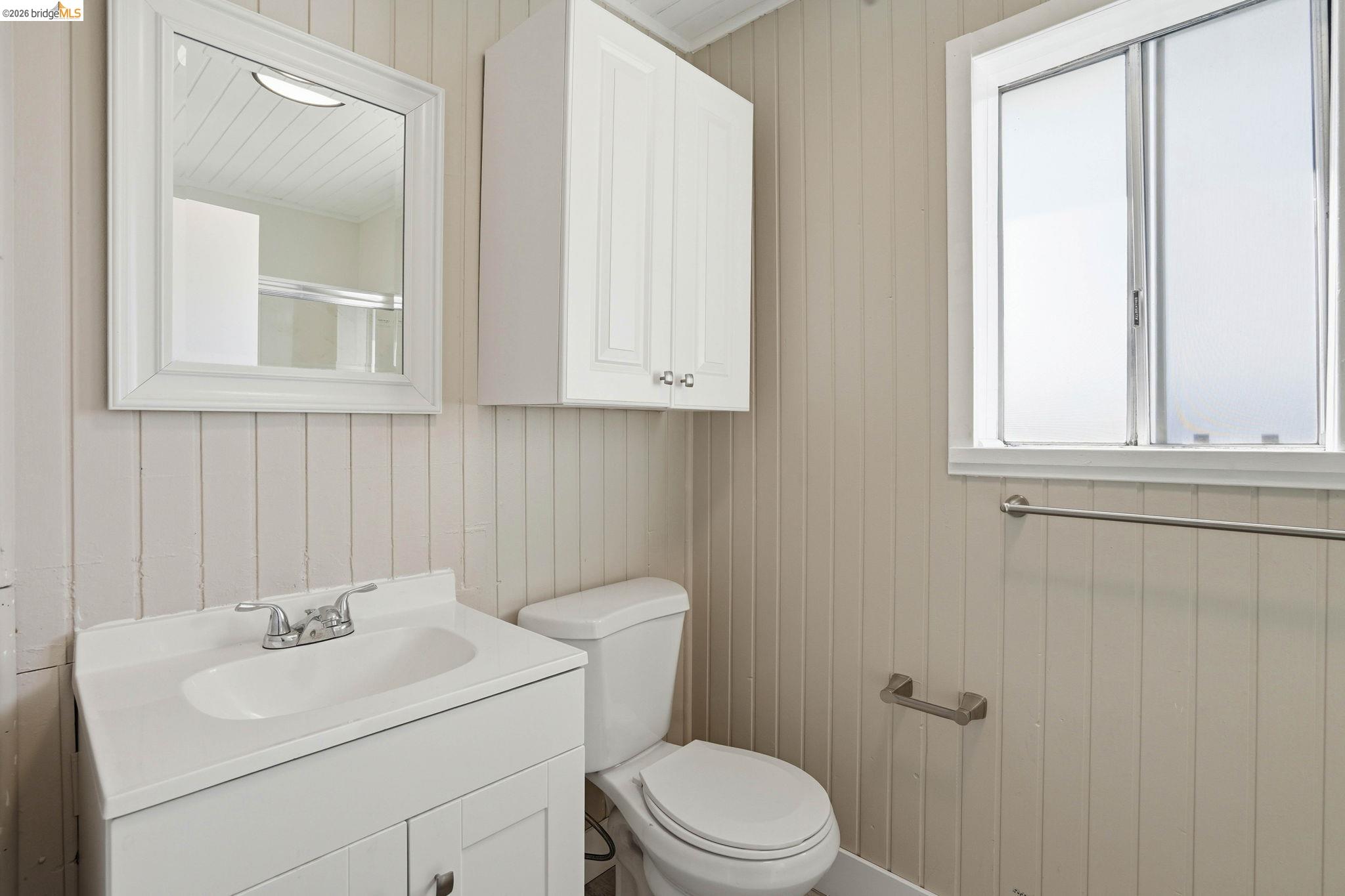 840 Key Rte Boulevard Albany, CA 94706 - Photo 35 of 43 Bathroom with vanity and wooden walls
