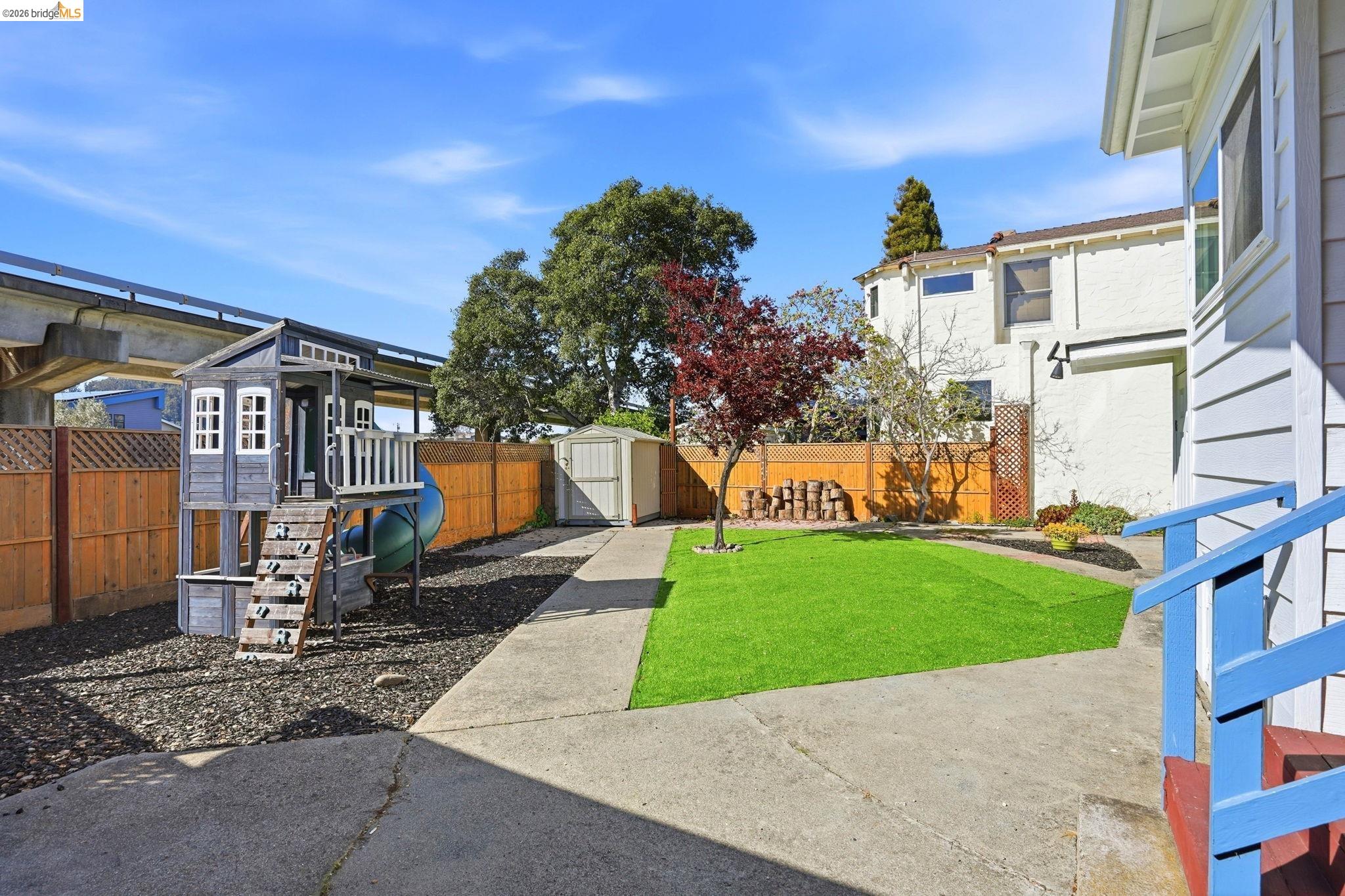 840 Key Rte Boulevard Albany, CA 94706 - Photo 39 of 43 Fenced backyard featuring a storage unit