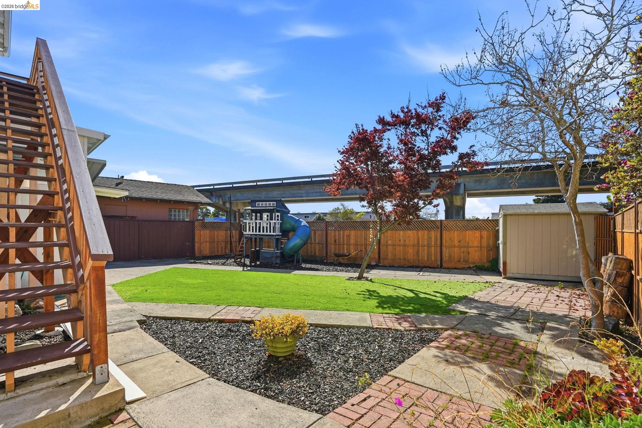 840 Key Rte Boulevard Albany, CA 94706 - Photo 42 of 43 Fenced backyard with stairway and a shed