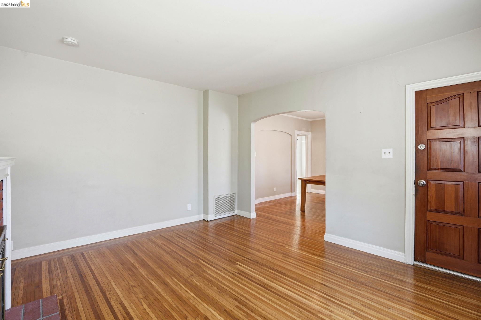 840 Key Rte Boulevard Albany, CA 94706 - Photo 7 of 43 Spare room with arched walkways and wood finished floors