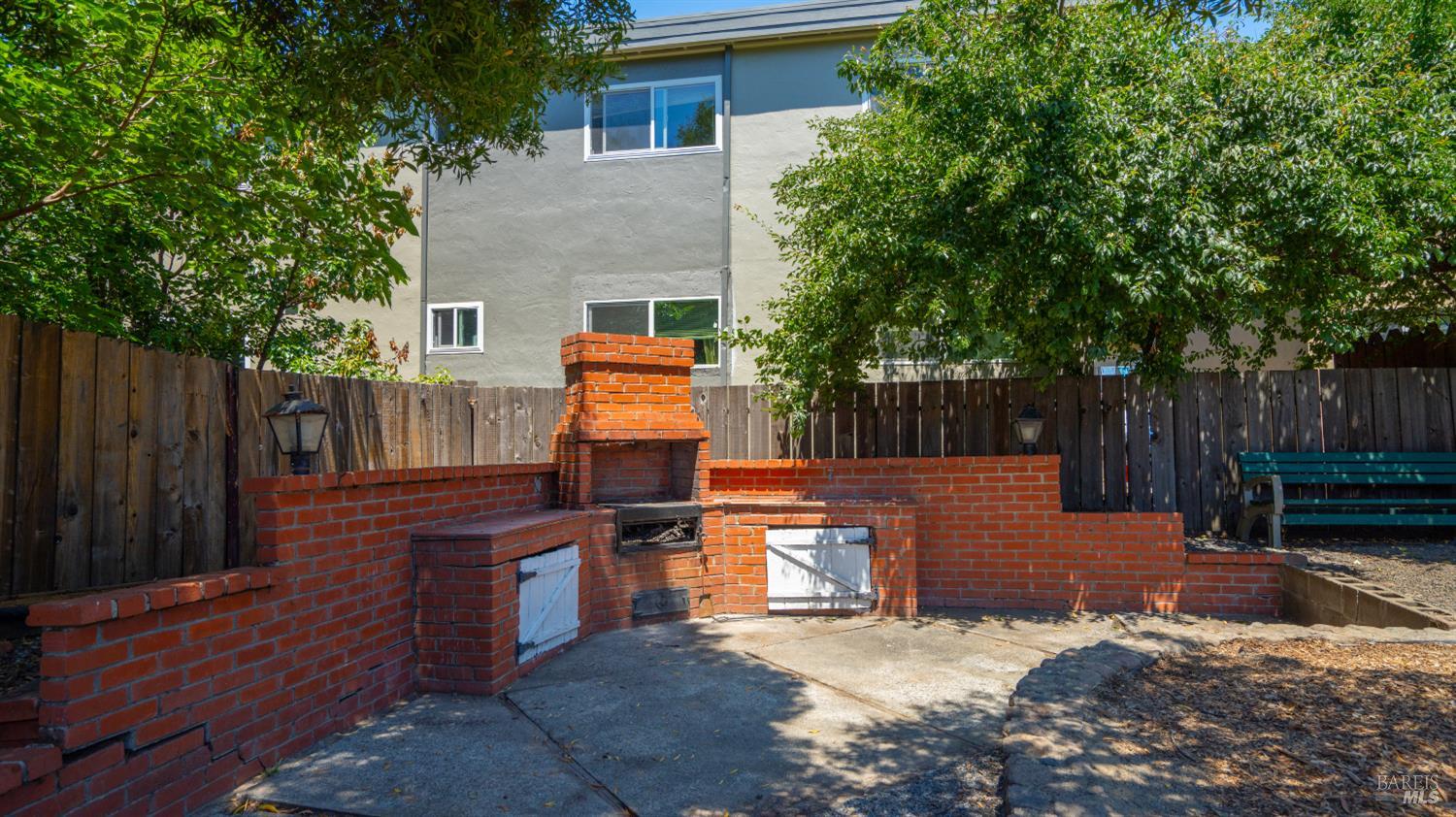 38 Bret Avenue San Rafael, CA 94901 - Photo 42 of 52 a view of a wooden bench in the backyard