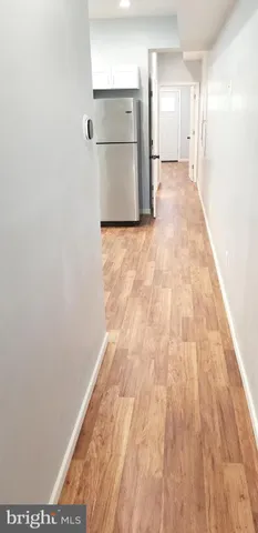 a kitchen with stainless steel appliances a refrigerator microwave and sink