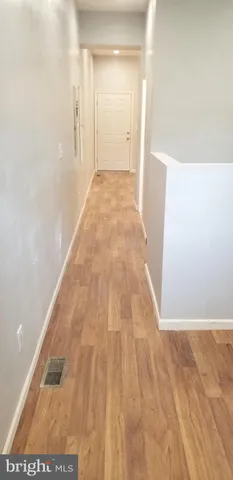 a view of a big room with wooden floor