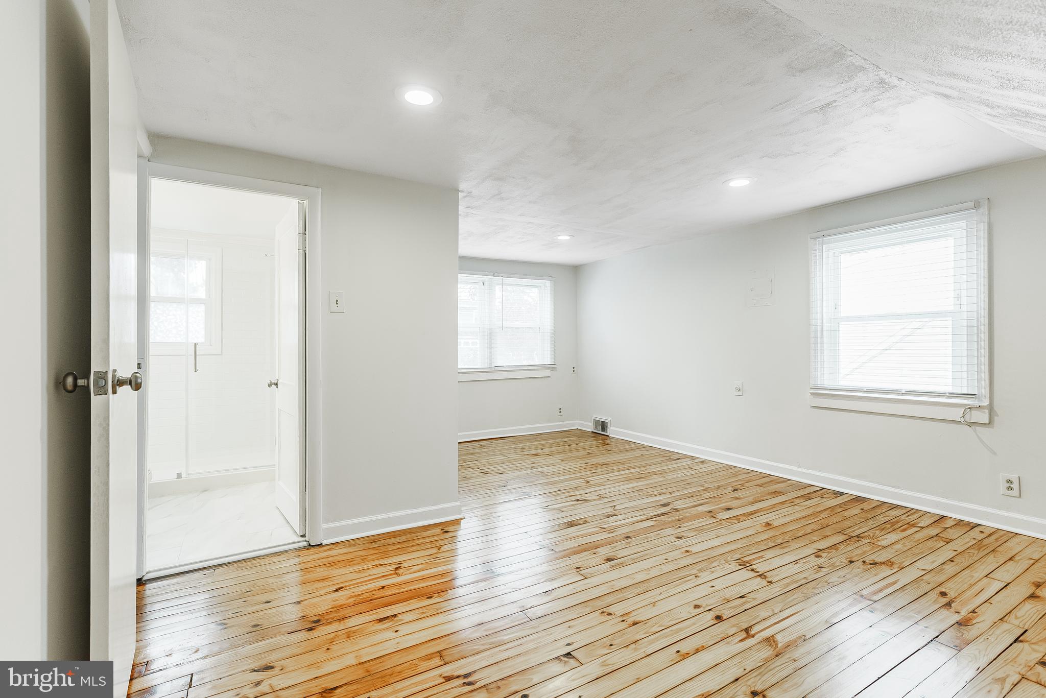 431 Central Avenue Glenside, PA 19038 - Photo 11 of 15 an empty room with wooden floor and windows
