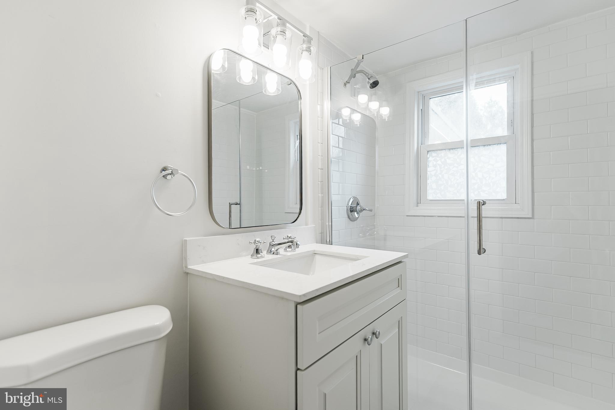 431 Central Avenue Glenside, PA 19038 - Photo 14 of 15 a bathroom with a toilet sink and mirror